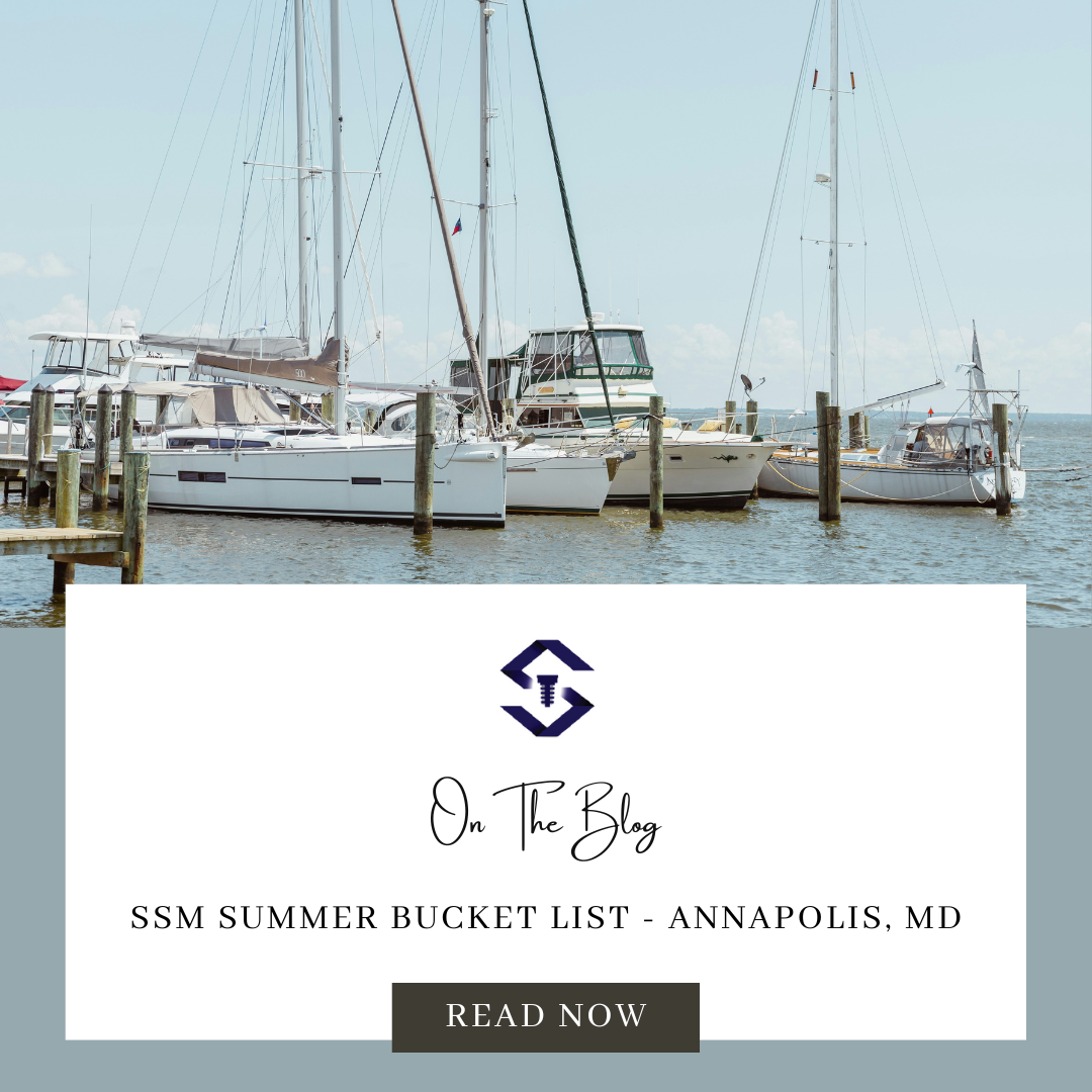 The image features a tranquil marina with several sailboats docked. Clear skies and calm waters set a serene scene. Promotional content for a summer bucket list blog.